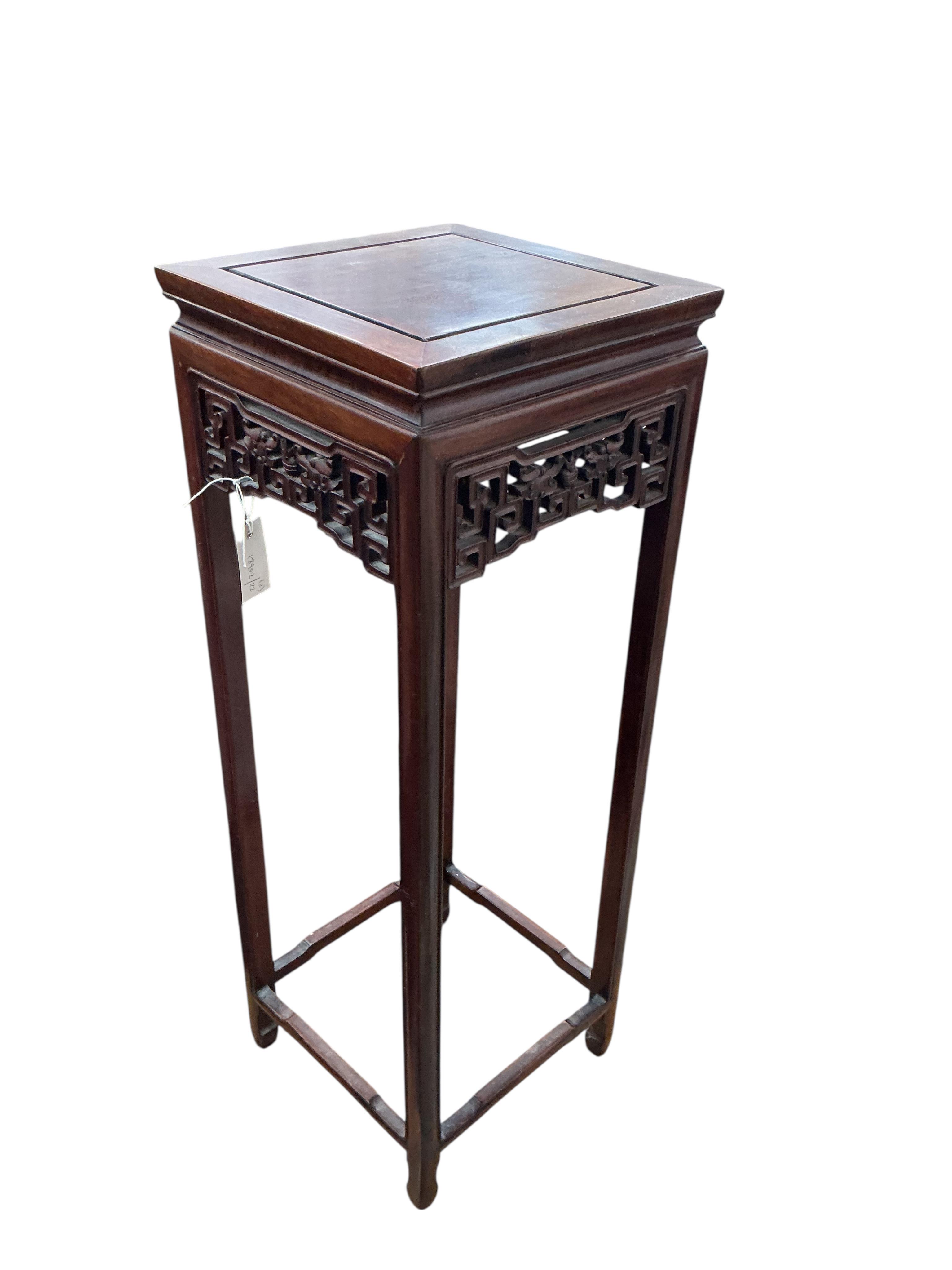 A Chinese carved hardwood vase stand, height 92cm together with a mid century two tier table